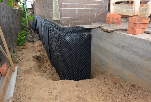 SJ Waterproofing Pros technician performing targeted Waterproofing assessment in Columbia, IL
